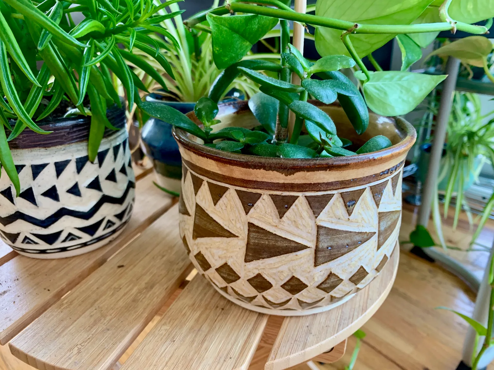 Sgraffito planter, 2019, glazed stoneware fired to Cone 6 oxidation, 4 x 5 x 5 in. A brown and honey-colored planter carved in a geometric pattern.