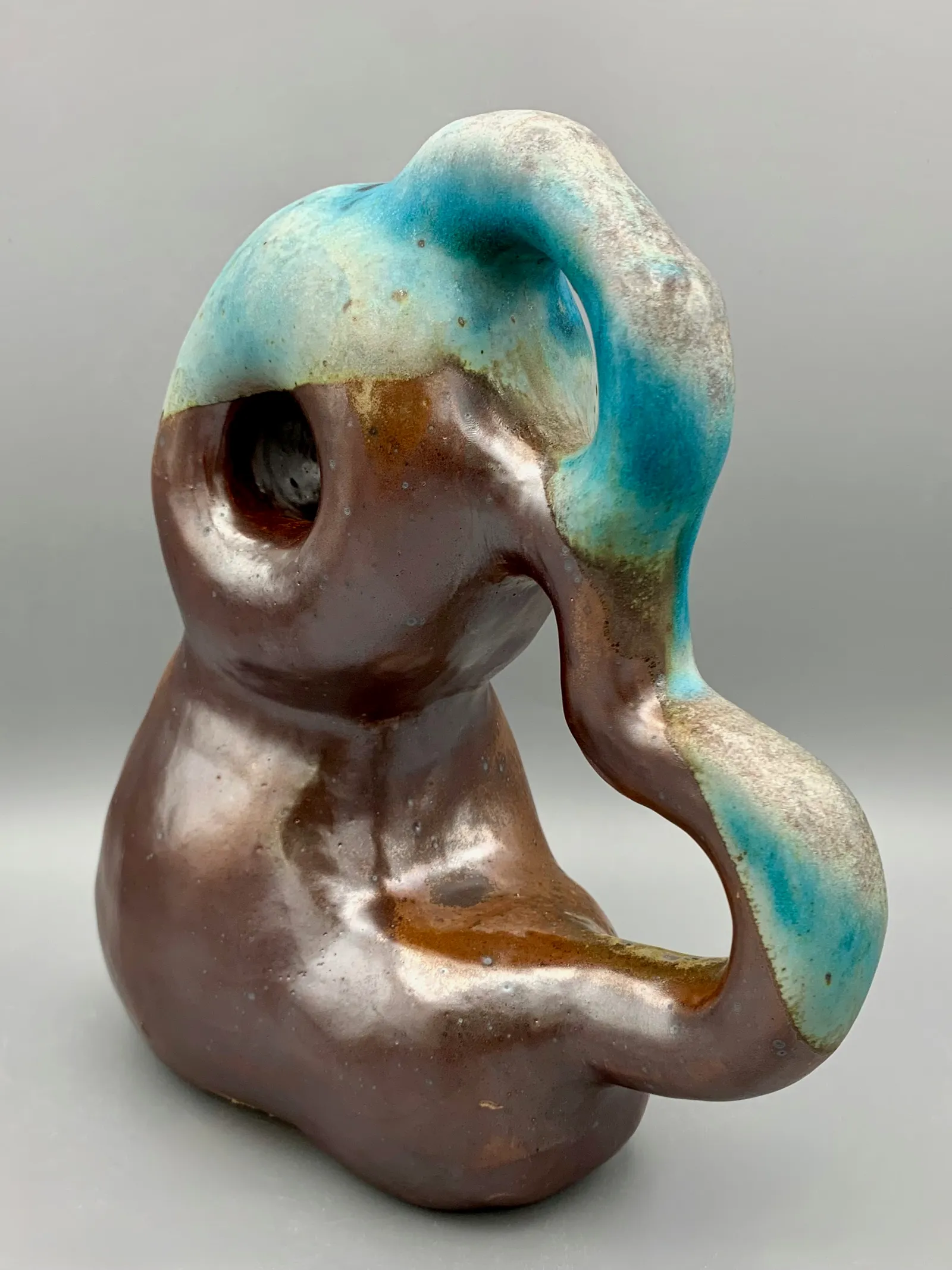 A brown and blue curvy sculpture